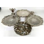 A set of 3 silver plated salver with shell and acanthus borders and chased decoration, on cast feet,