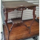 An Edwardian oak occasional table with scalloped square top, fretwork frieze and undershelf; A