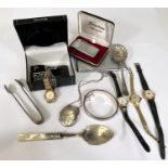 A silver locket and bangle; other ladies watches etc.