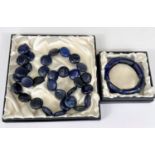 A lapis lazuli necklace formed from flattened beads; a similar bracelet, elasticated