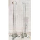 A pair of tall slender ribbed vases, height 50cm.