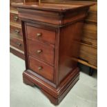 A "Multiyork" style stained cherrywood 3 drawer bedside cabinet