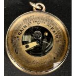 An unusual miniature aneroid barometer in yellow metal fob case, stamped 18ct, diameter2.5cm,