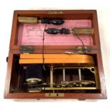 An early 20th century electric shock machine in mahogany case