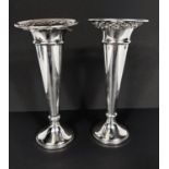 A hallmarked silver pair of specimen vases with pierced rims (a.f.); a silver plated hotel ware