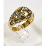 An 18 carat hallmarked gold dress ring set with pairs of diamonds in 12 lozenge shaped insets, 24