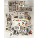 A selection of cigarette cards:  golf; horses; ships; cars; bikes; dogs; cricket
