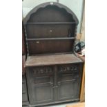 An oak reproduction Dutch dresser with 3 shelves, 2 height and double cupboard/drawers, width 94cm