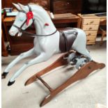 A "Ragamuffin" dapple grey rocking horse with rear spring action, length 175cm