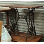 Two cast iron Singer sewing machine based pub tables