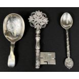 A silver Victorian caddy spoon, a 1935 GV commemorative silver spoon and a silver key