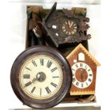 A 19th century Postman's Alarm; a black forest cuckoo clock; similar clocks