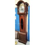 An early 20th century Georgian style mahogany longcase clock with arched hood, brass dial and spring