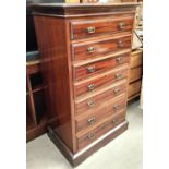 MAPLES & CO: A narrow Edwardian mahogany 7 height chest of drawers with brass drop handles, width