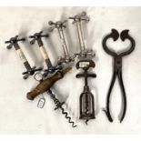 Two 19th century vintage corkscrews; a pair of sugar nips