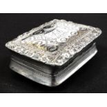 A hallmarked silver rectangular vinaigrette with chased decoration and gilt pierced grill, by