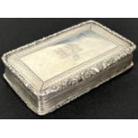 An early Victorian silver snuff box, rectangular form with repousse border, gilt interior,