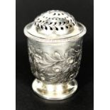 A late Georgian silver muffineer, cylindrical form with repousse decoration and domed top, on