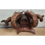 A 19th century Butchers sign in the form of rams horns with metal decorations