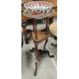 A 19th century 3 tier circular washstand with later Imari pattern bowl