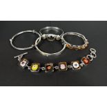 A hallmarked silver bangle set amber stones; 3 others, stamped '925', set various stones; a