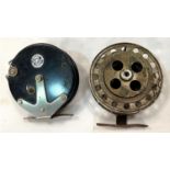 A vintage 4.1/4" fishing reel and a Strike Right reel