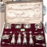 A hallmarked silver 10 piece cruet set in the Georgian style comprising 4 salts, 4 pepper pots and 2