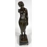 Van de Voorde:  bronze female nude standing holding her neck, on marble base, signed, height 35cm
