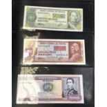 A collection of 54 foreign banknotes in an album: Brazilian/Venezuelan, Indonesian, etc.