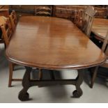 A reproduction oak dining suite comprising table with extending rounded rectangular top and 6 ladder