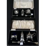 A hallmarked silver 3 piece cruet set, boxed, Birmingham 1957, 2oz (mustard hinge a.f.); a