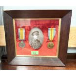 A framed pair of WWI medals awarded to Harold Joseph Cook with framed death plaque