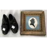 A pair of 19th century child's clogs; a silhouette, female head and shoulders, framed and glazed