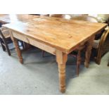 A pine rectangular dining table and 4 spindle back chairs