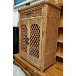 A wickerwork side cabinet