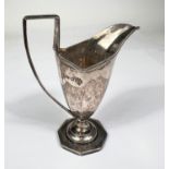 A hallmarked silver cream jug in classical ribbed style on octagonal pedestal base, Birmingham