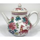 A 19th century Chinese famille rose small teapot decorated with chrysanthemums; animals; etc.,