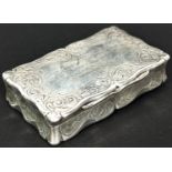 A Victorian silver snuff box, shaped rectangular form with foliate engraving and contemporary