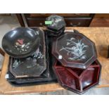 A Japanese black lacquer hexagonal mother of pearl inlaid box, two similar trays, a similar hors d'