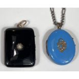 A hinged rectangular pendant/locket in black enamel with seed pearl; another, oval, in turquoise