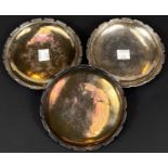 A hallmarked silver set of 3 circular shallow dishes with reeded dentil borders, impressed 'Omar