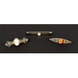 A filigree bar brooch set with a cameo, stamped '800'; a filigree bar brooch set red cabochon stone,