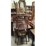 An Ercol dark oak dining suite comp. drop leaf table and 4 high hoop and stick back dining chairs