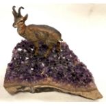 A cold painted mountain goat on base of amethyst crystal sample, length 11.5cm