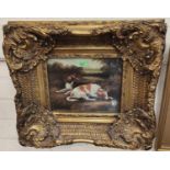 A large gilt framed 19th century style textured print of Spaniels; another similar picture in gilt