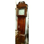An early 19th century oak and mahogany longcase clock, the hood with swan neck pediment and square