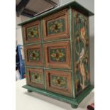 A 6 drawer dwarf chest, painted; 2 small glazed cabinets