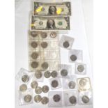 A selection of US State quarters (29 coins) and 2 US $1 notes