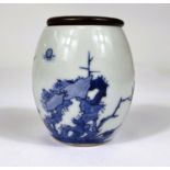 A Chinese blue and white barrel shaped vase with leaf mark to base and wooden lid, ht. 8cm and a