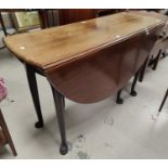 A mid 18th century mahogany dining table with oval drop leaf top, on pad feet, length 128cm